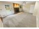 Large living room with a brick fireplace and ample natural light from a large window at 724 Dukehart Ct, Stone Mountain, GA 30083