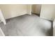 Spacious living room featuring light gray carpet and ample natural light at 724 Dukehart Ct, Stone Mountain, GA 30083