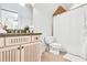 Bright bathroom featuring vanity with stone countertops and a shower with a curtain at 90 W Peachtree St, Norcross, GA 30071