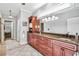 Bathroom featuring double sinks, granite countertops, and ample storage space at 90 W Peachtree St, Norcross, GA 30071