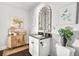 Elegant bathroom with decorative mirror, modern vanity, and stylish botanical artwork at 90 W Peachtree St, Norcross, GA 30071