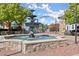 Stone fountain is the centerpiece of Lillian Webb Park with manicured landscaping and walking paths at 90 W Peachtree St, Norcross, GA 30071