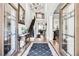 Grand foyer with hardwood floors, high ceilings, elegant staircase, and a view to other rooms at 90 W Peachtree St, Norcross, GA 30071