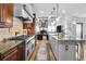 Spacious kitchen with island, stainless steel appliances, and a seamless transition to the living area at 90 W Peachtree St, Norcross, GA 30071