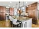 Elegant kitchen with a large island featuring granite countertops, seating, and custom cabinetry at 90 W Peachtree St, Norcross, GA 30071