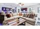 Open living room with a sectional sofa and bar in the background at 90 W Peachtree St, Norcross, GA 30071
