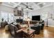 Bright living room with coffered ceilings, a fireplace, and expansive windows offering natural light at 90 W Peachtree St, Norcross, GA 30071