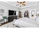 Bright primary bedroom suite with tray ceilings, plush carpet, and relaxing decor at 90 W Peachtree St, Norcross, GA 30071