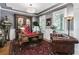 Well-appointed office featuring custom millwork, hardwood floors, and a plush leather sofa at 90 W Peachtree St, Norcross, GA 30071