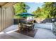 Outdoor patio boasts a built-in fireplace, grill, and dining area perfect for entertaining at 90 W Peachtree St, Norcross, GA 30071