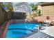 Backyard pool area with a refreshing pool and charming brick accents at 90 W Peachtree St, Norcross, GA 30071