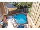 An aerial view of the sparkling blue backyard pool surrounded by brick walls, perfect for relaxation and entertaining at 90 W Peachtree St, Norcross, GA 30071