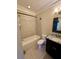 Bathroom featuring a shower-tub combo, toilet, and vanity with granite countertop at 1194 John Collier Rd, Atlanta, GA 30318