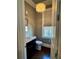 Stylish half-bathroom with marble countertop, elegant lighting, and hardwood floors at 1194 John Collier Rd, Atlanta, GA 30318