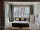 Cozy bedroom area with natural light, with a large daybed for guests at 1194 John Collier Rd, Atlanta, GA 30318