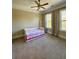 Comfortable bedroom with carpet, with curtains framing views of mature trees at 1194 John Collier Rd, Atlanta, GA 30318