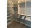 Spacious walk-in closet with custom shelving and ample storage space at 1194 John Collier Rd, Atlanta, GA 30318