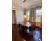 Formal dining room featuring hardwood floors, large windows, and elegant chandelier at 1194 John Collier Rd, Atlanta, GA 30318