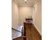 Well-lit upstairs hallway with hardwood floors and charming decorative accents at 1194 John Collier Rd, Atlanta, GA 30318