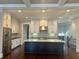 Gourmet kitchen with granite countertops, stainless steel appliances, and a large island at 1194 John Collier Rd, Atlanta, GA 30318