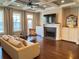 Bright living room featuring coffered ceilings, hardwood floors, and a cozy fireplace at 1194 John Collier Rd, Atlanta, GA 30318