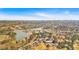 Overhead view showcasing the golf course and lake with surrounding lush greenery in this beautiful neighborhood at 2445 Ridgelake Dr, Villa Rica, GA 30180
