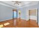 Large bedroom with tray ceilings, hardwood floors and a full ensuite bathroom at 2445 Ridgelake Dr, Villa Rica, GA 30180