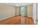 Inviting bedroom with ample natural light and beautiful wood flooring at 2445 Ridgelake Dr, Villa Rica, GA 30180