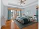 Bright bedroom with large windows, tray ceiling, and hardwood floors at 2445 Ridgelake Dr, Villa Rica, GA 30180