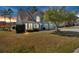 Stunning home exterior featuring a lush lawn, mature trees, and a two-car garage, creating a picturesque and appealing setting at 2445 Ridgelake Dr, Villa Rica, GA 30180