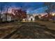 Exterior of the home with well-maintained lawn and mature trees at 2445 Ridgelake Dr, Villa Rica, GA 30180