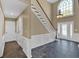 Grand foyer with soaring ceilings, a staircase, and tiled floors, creating an impressive and inviting entrance at 2445 Ridgelake Dr, Villa Rica, GA 30180