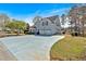 Charming two-story home with a spacious driveway, attached two-car garage, and professionally landscaped front yard at 2445 Ridgelake Dr, Villa Rica, GA 30180
