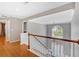 Bright hallway with wood floors and a window overlooking the front yard at 2445 Ridgelake Dr, Villa Rica, GA 30180