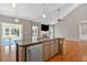 Modern kitchen with stainless steel appliances, granite countertops, and an island at 2445 Ridgelake Dr, Villa Rica, GA 30180
