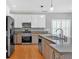 Well-lit kitchen featuring stainless steel appliances and granite countertops at 2445 Ridgelake Dr, Villa Rica, GA 30180