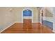 Open floor plan showcases beautiful hardwood floors and archways connecting rooms at 2445 Ridgelake Dr, Villa Rica, GA 30180