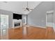 Cozy living room with fireplace, large windows, and vaulted ceiling at 2445 Ridgelake Dr, Villa Rica, GA 30180