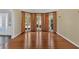 Open living room with hardwood floors, featuring a front door at 2445 Ridgelake Dr, Villa Rica, GA 30180