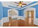 Spacious living room with hardwood floors and an arched doorway to stairs at 2445 Ridgelake Dr, Villa Rica, GA 30180