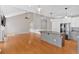 Spacious living room and kitchen with hardwood floors and stainless steel appliances at 2445 Ridgelake Dr, Villa Rica, GA 30180