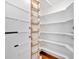 Pantry with adjustable wooden shelves at 2445 Ridgelake Dr, Villa Rica, GA 30180