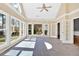 Bright sunroom with tile floors, multiple windows, and French doors for seamless indoor-outdoor living at 2445 Ridgelake Dr, Villa Rica, GA 30180