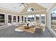 Bright sunroom with large windows overlooking the landscaped backyard and lake at 2445 Ridgelake Dr, Villa Rica, GA 30180