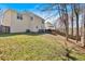 Expansive backyard featuring a deck, lush lawn, and privacy fencing at 4342 Richmond Nw Pl, Acworth, GA 30101