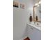 Cozy powder room with a framed mirror and single sink vanity at 4342 Richmond Nw Pl, Acworth, GA 30101