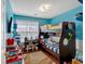 Colorful ' bedroom with bunk beds, a desk, and hardwood floors at 4342 Richmond Nw Pl, Acworth, GA 30101