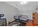Bonus room featuring desk, spin bike and bed with hardwood floors and lots of natural light at 4342 Richmond Nw Pl, Acworth, GA 30101