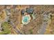 Aerial shot of a community pool and amenities, featuring a spacious pool area, playground, and ample parking at 4342 Richmond Nw Pl, Acworth, GA 30101