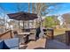 Outdoor deck with seating, umbrella, and grill, perfect for entertaining guests at 4342 Richmond Nw Pl, Acworth, GA 30101
